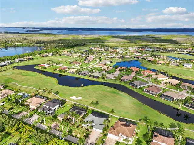 Bird's eye view featuring a water view, a residential view, and golf course view