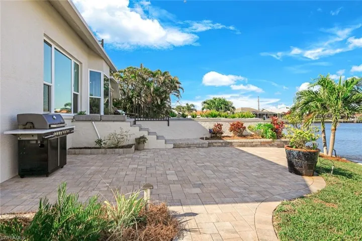 View of patio featuring a grill