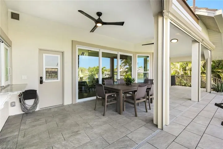 View of patio featuring ceiling fan and outdoor dining area