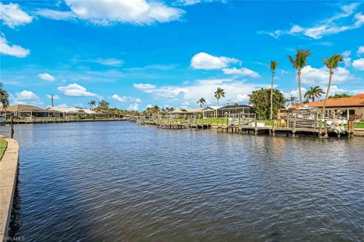View of water feature featuring a boat dock and a residential view