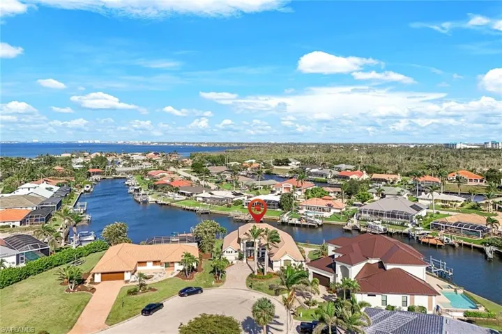 Aerial view featuring a water view and a residential view