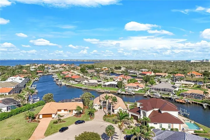 Drone / aerial view with a water view and a residential view