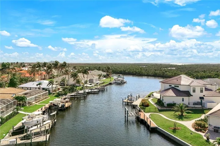 View of water feature with a dock, a residential view, and boat lift