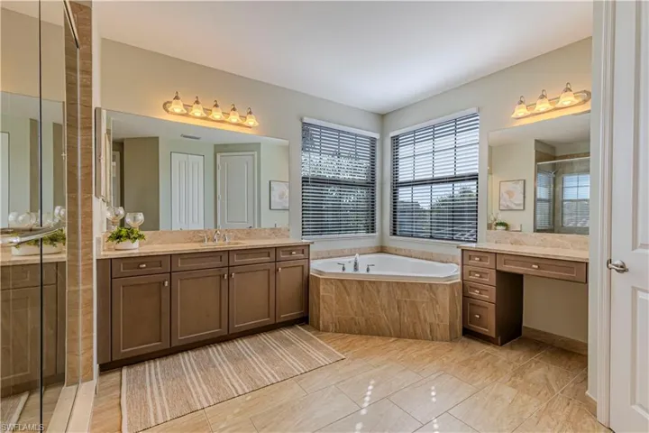 Primary bath has dual sinks & dual water closets