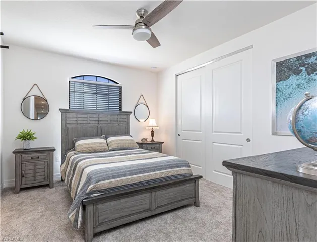 Guest bedroom in front of home with large closet & Jack 'n Jill bath
