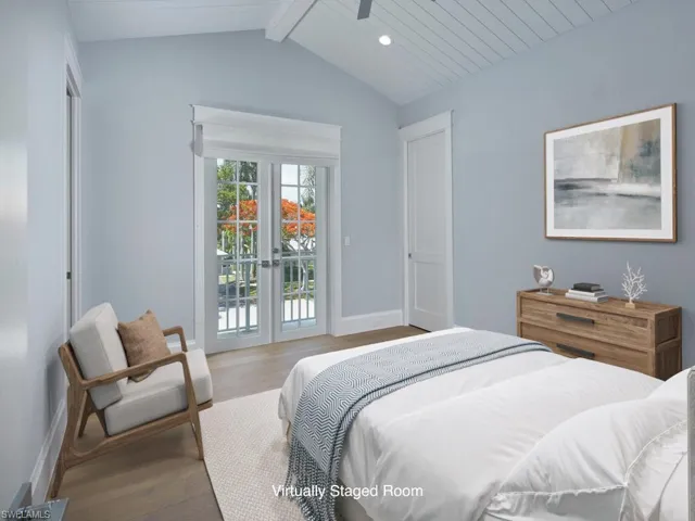 Bedroom featuring wood finished floors, access to exterior, baseboards, french doors, and recessed lighting
