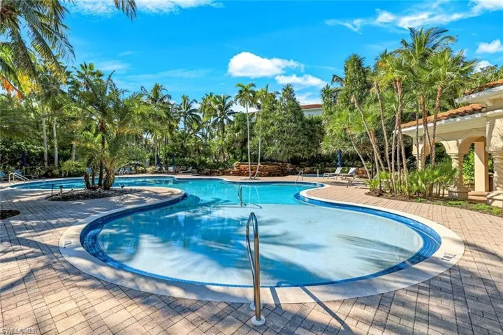 Community pool featuring a patio area