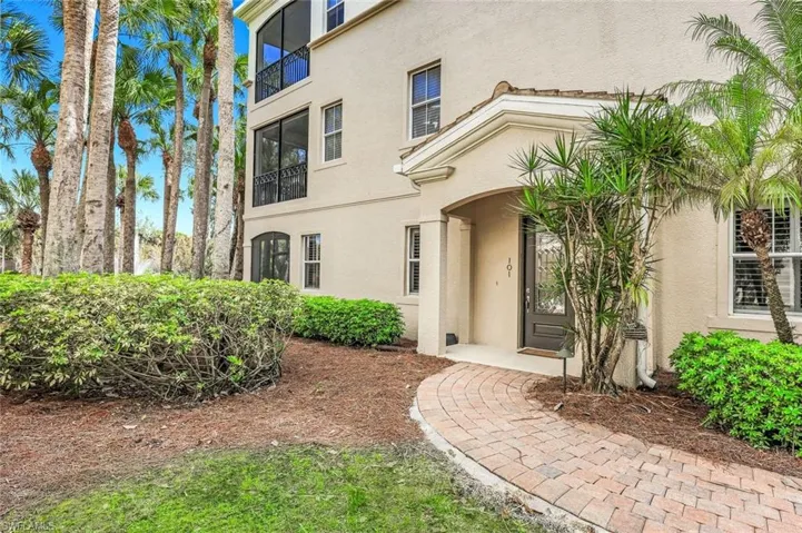 Property entrance featuring stucco siding
