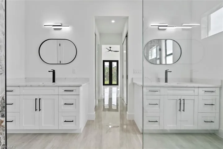 Bathroom featuring vanity, wood-type flooring, and ceiling fan