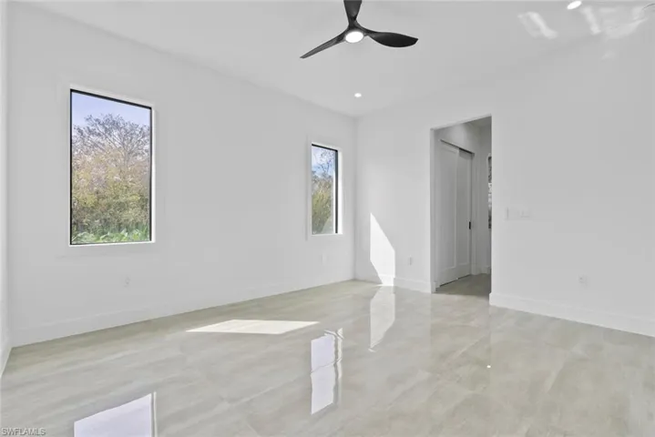 Unfurnished room featuring ceiling fan