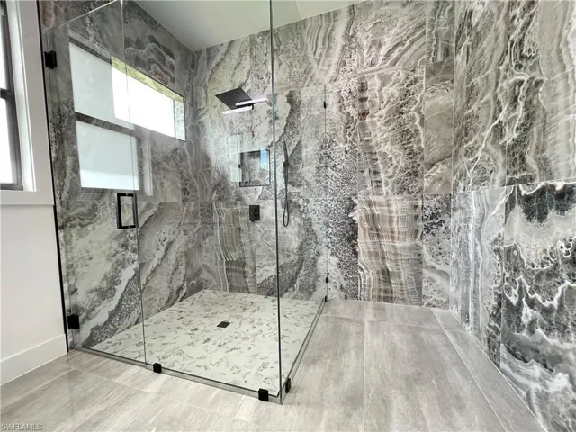 Bathroom with a shower with door