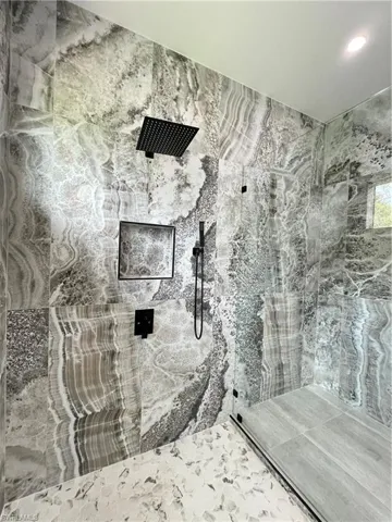 Bathroom featuring tiled shower