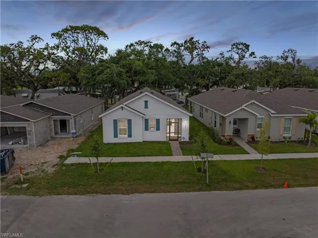 View of front of home featuring a lawn