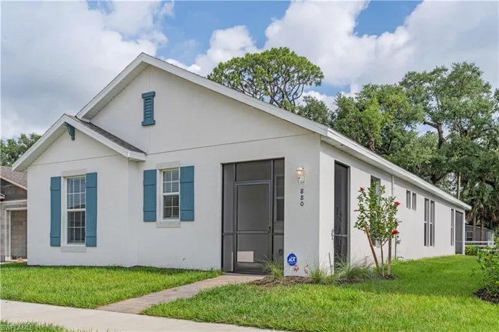 View of front of property with a front lawn