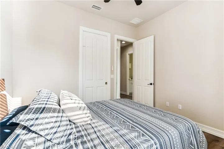 Bedroom with wood finished floors and a ceiling fan
