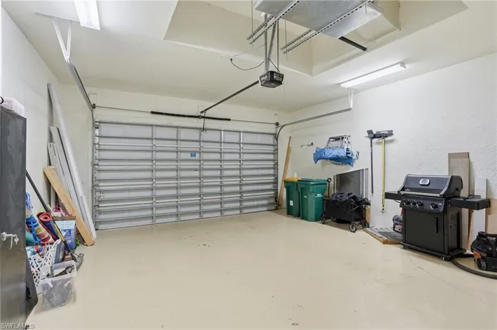 Garage featuring a garage door opener