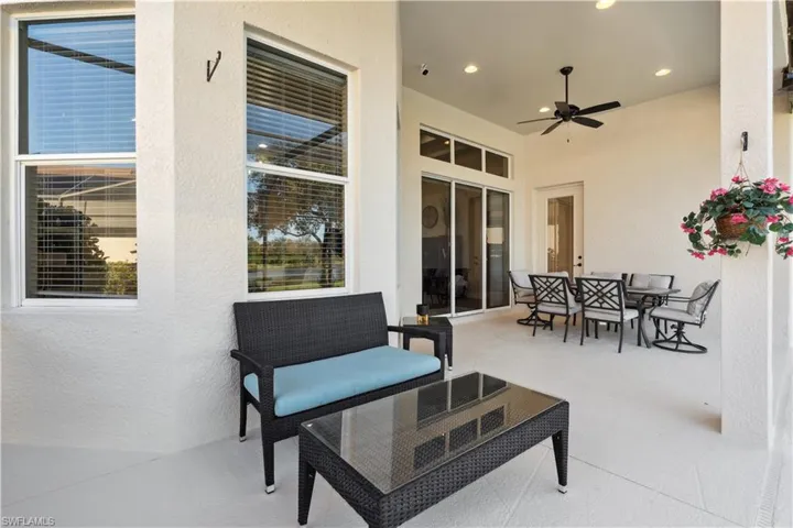 View of patio featuring outdoor dining area and a ceiling fan