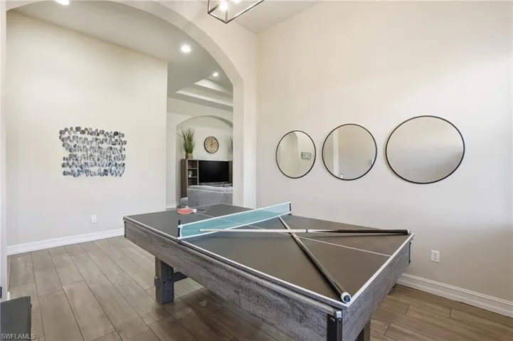 Rec room featuring recessed lighting and arched walkways