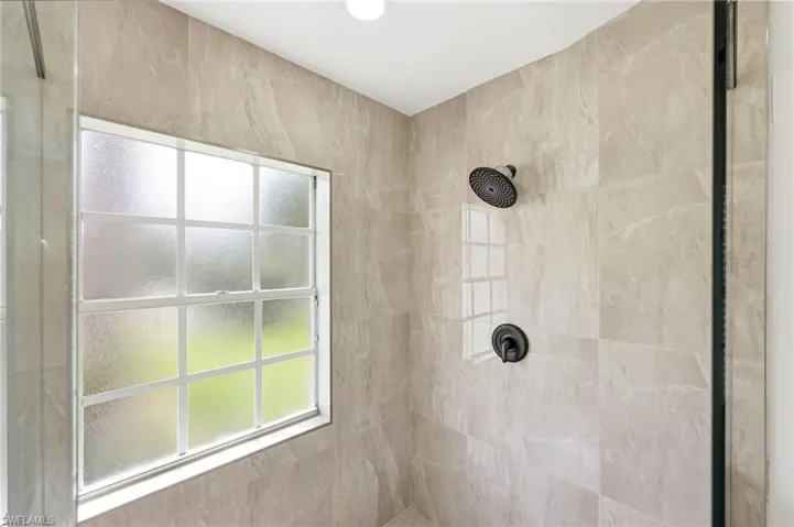 Bathroom featuring a tile shower