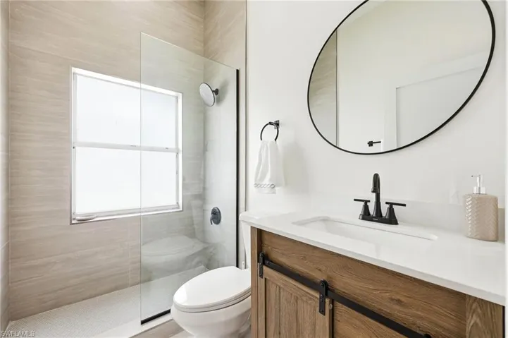 Bathroom with vanity and a walk in shower