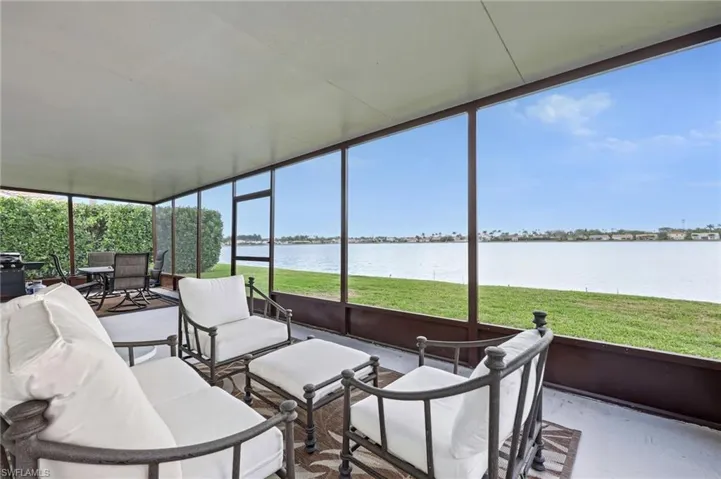 Sunroom featuring a water view and outdoor lounge area