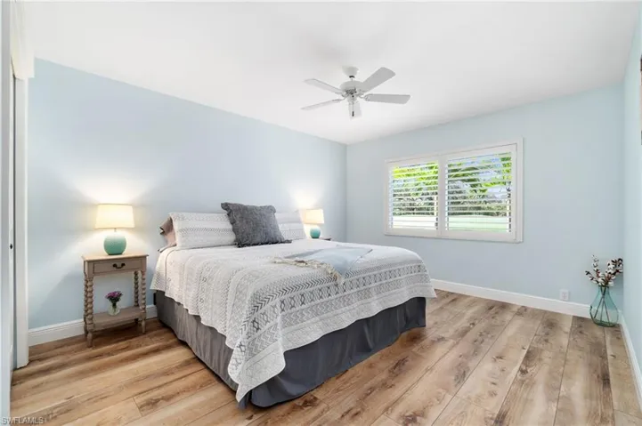 Large guest bedroom with golf course view
