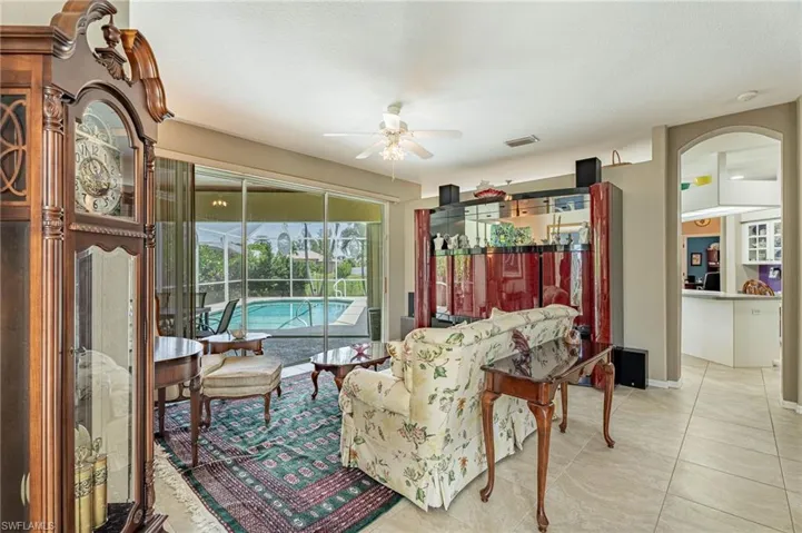 Living room, view of pool and entry to Kitchen to the right.