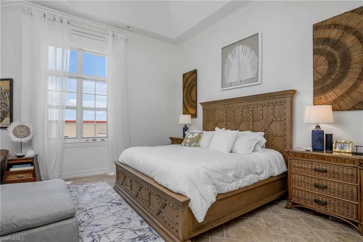 Tiled bedroom with ornamental molding