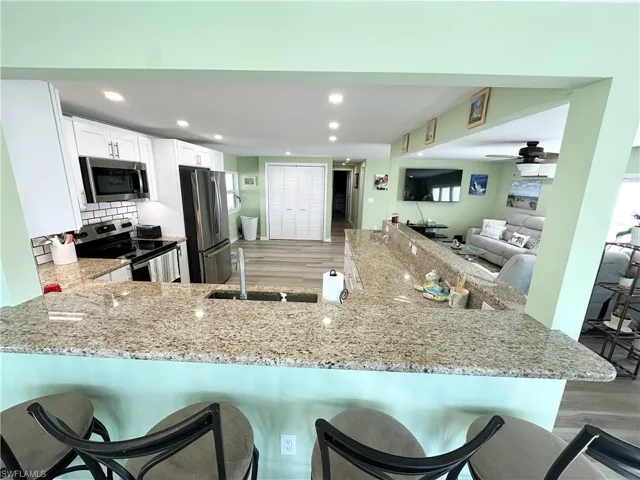 looking into the kitchen from the breakfast bar