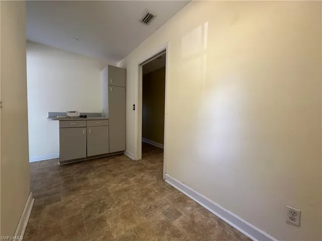 Other Side of the Inside Laundry Area with Cabinets