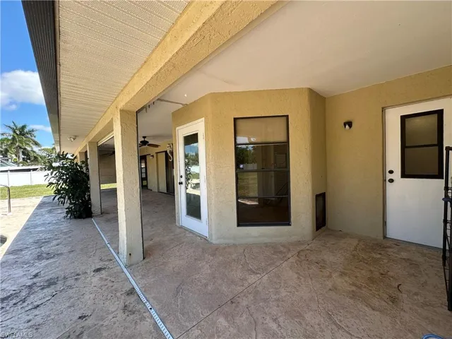View of Patio/Terrace with Pool Bath access and the Doggie Door to the Bottom Left.