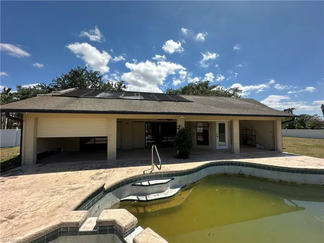 Rear View of House and Electric Hurricane Shutters