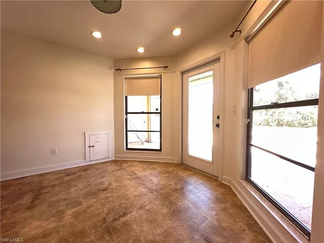 Dining Area in the Kitchen, and if you look to the Bottom Left, you can See the Doggie Door!