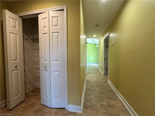Hallway from Living Room area to Guest Bedroom's With a Large Linen Closet