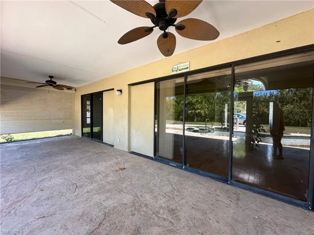 View of the Covered Patio Featuring Several Pocket Sliding Doors into the Home