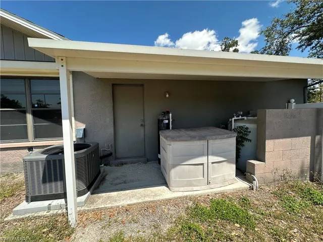 Doorway to Garage w/ Central AC Unit and Full House Reverse Osmosis System with Filtration and Softener System
