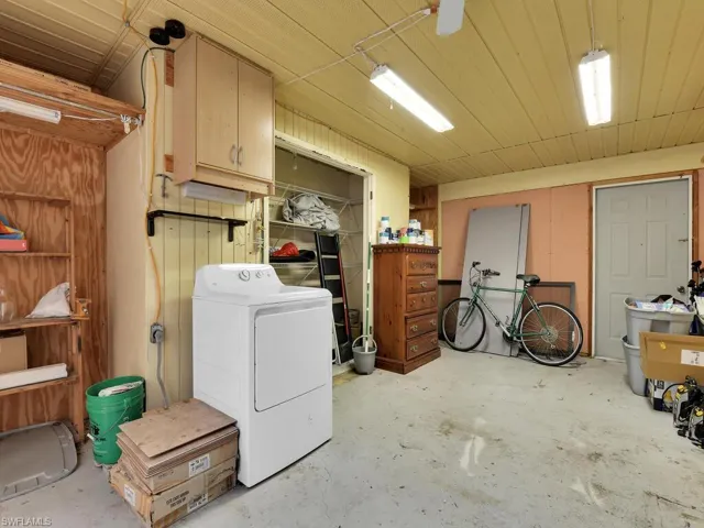 Clothes washing area featuring washer / dryer