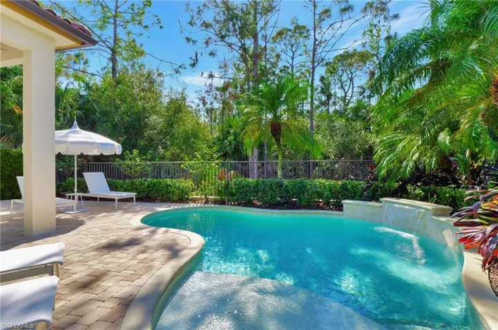 View of swimming pool with water feature