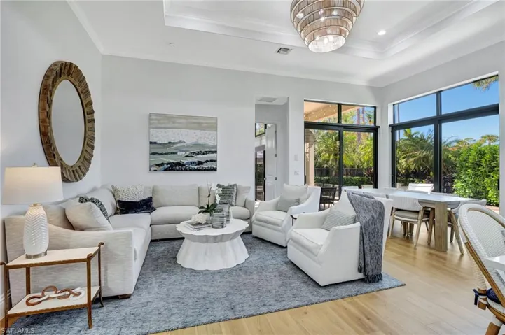 Living room with a raised ceiling. Open floor plan