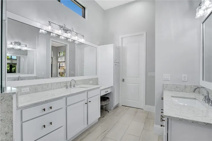 Remodeled Master Bathroom with dual separate sinks with quartz countertops
