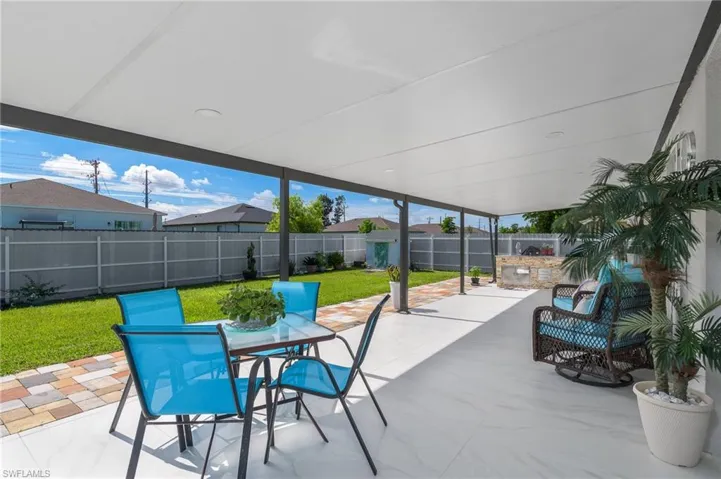 Fenced backyard featuring outdoor dining space and a patio area