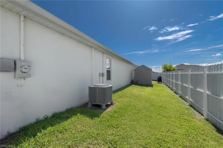 View of yard featuring a storage unit