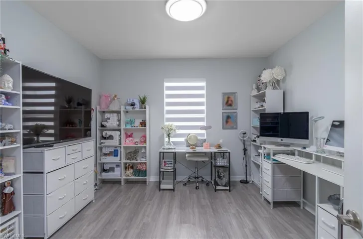 Office featuring light wood-type flooring and baseboards