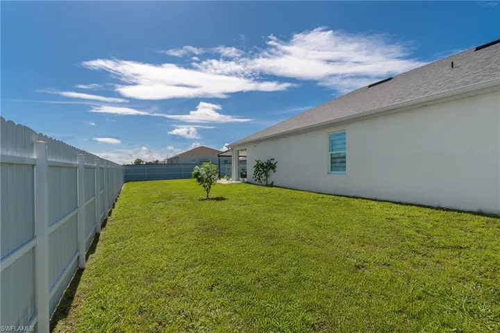 View of fenced backyard