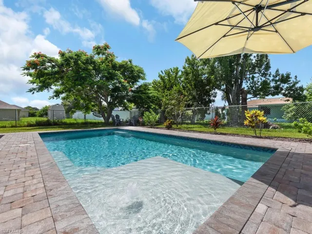 View of pool featuring a fenced backyard