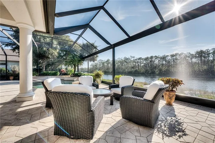 View of patio / terrace with a water view and glass enclosure