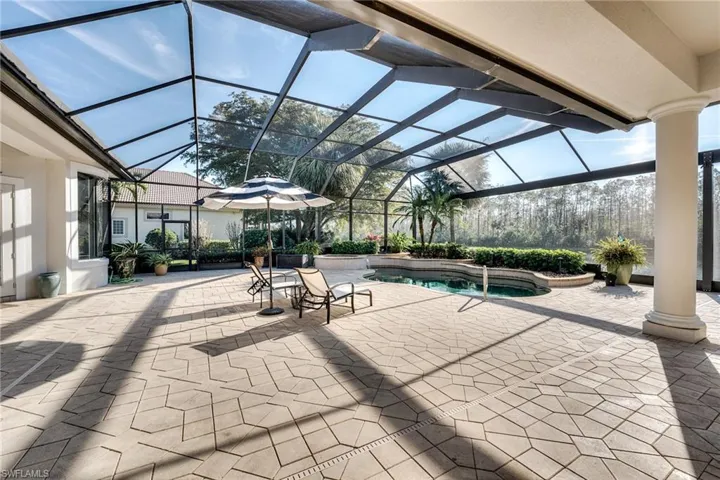 View of patio / terrace featuring a lanai