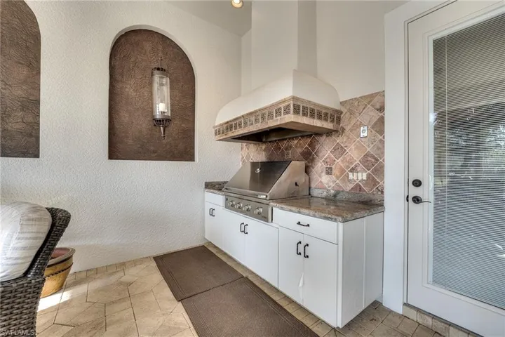 View of patio / terrace with a grill and exterior kitchen