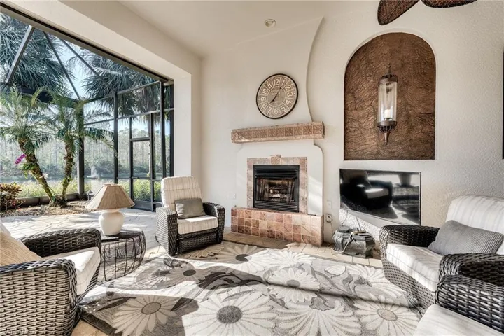 Living room with lofted ceiling and a tile fireplace