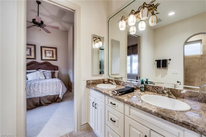 Bathroom with vanity and ceiling fan